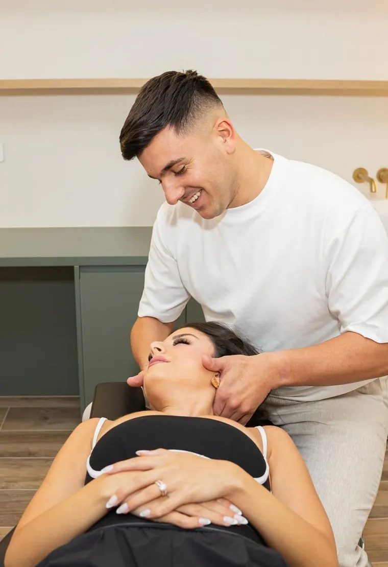 Dr Louie Nouh performing a chiropractic neck adjustment at BellPoint Health & Wellness